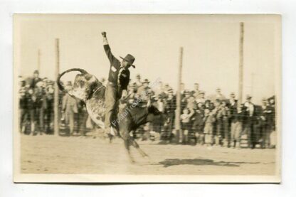 unidentified-cowboy-riding-bull-3907